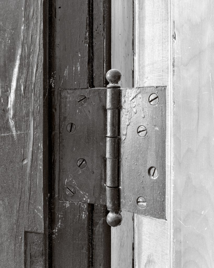 Selective demolition and preservation of the historic door hinges