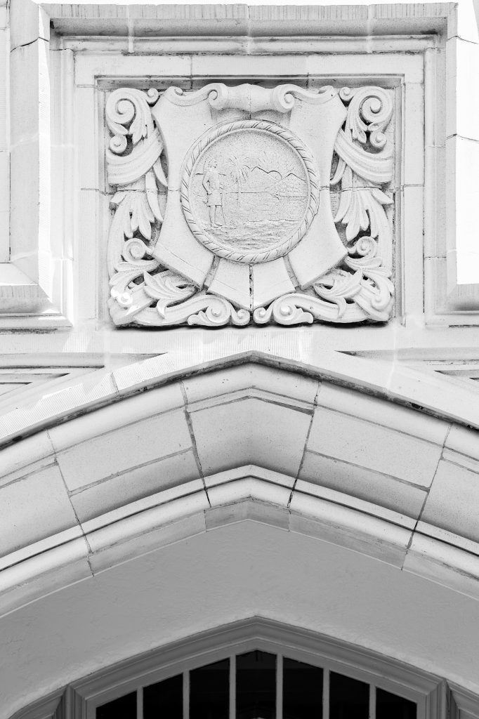 Crest within the tympanum at FSU's College of Criminology